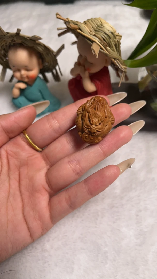 橄榄核雕刻龙头单籽