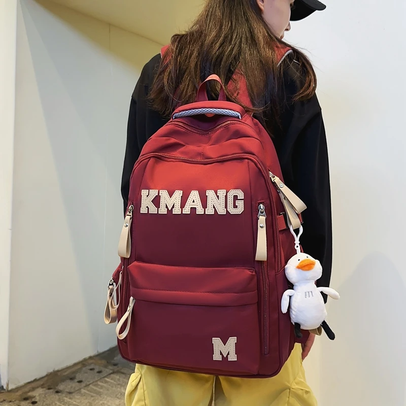 爆款机能高中生书包男简约初中生校园双肩背包女减负多层电脑包男