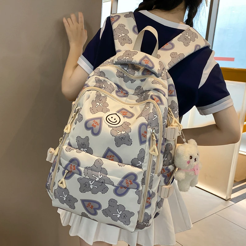 减负爱心双肩包网红款大容量防水高中女学生书包推荐初中五六年级