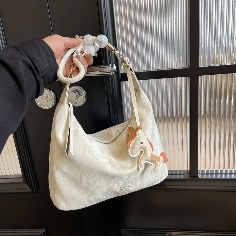 斜挎包包女士2024新款高级感时尚单肩包小众设计通勤百搭风饺子包