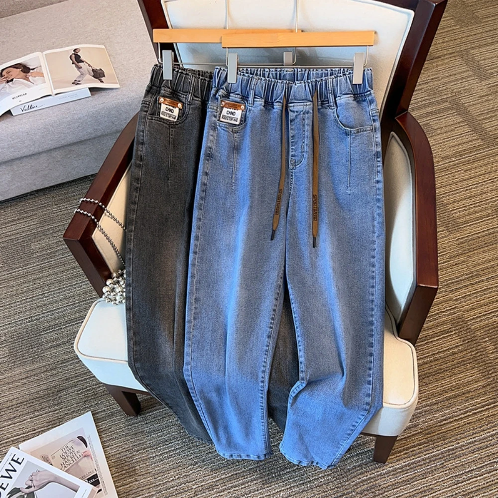 300斤大码胖妹妹松紧腰牛仔裤女宽松显瘦哈伦裤200胖mm弹力裤子秋