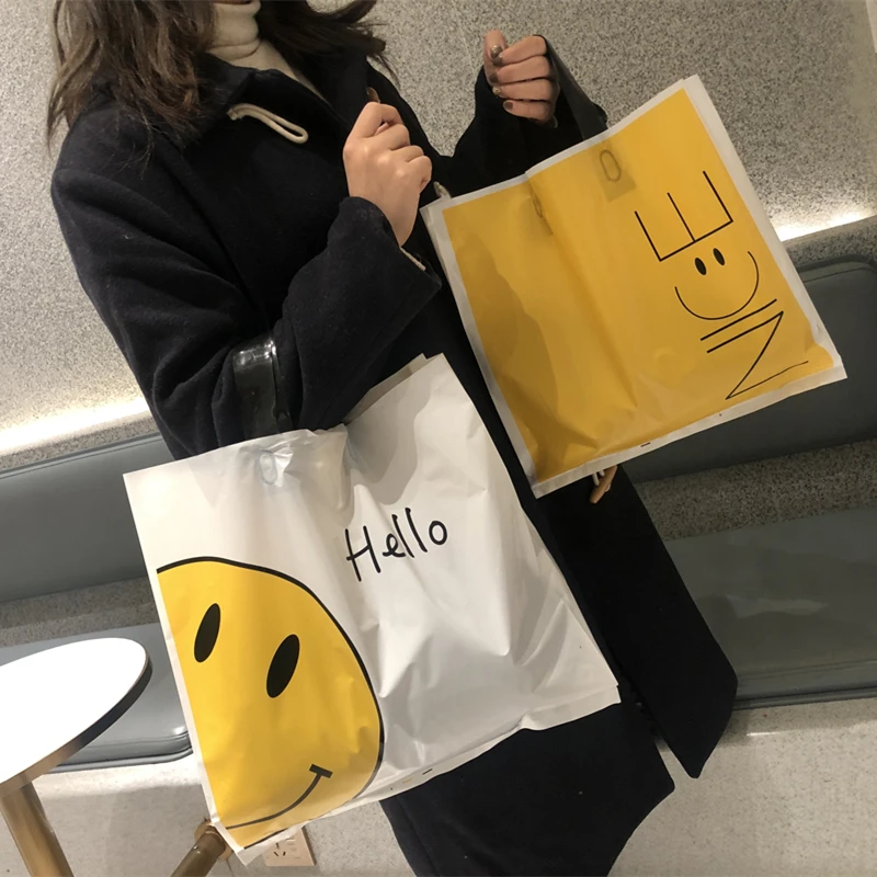 加厚笑脸袋童装女装服装店袋子定做塑料礼品购物手提袋定制装衣服